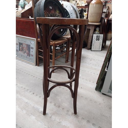 507 - Two bentwood bar stools. {80 cm H x 37 cm Dia.}.