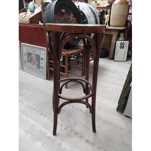 507 - Two bentwood bar stools. {80 cm H x 37 cm Dia.}.