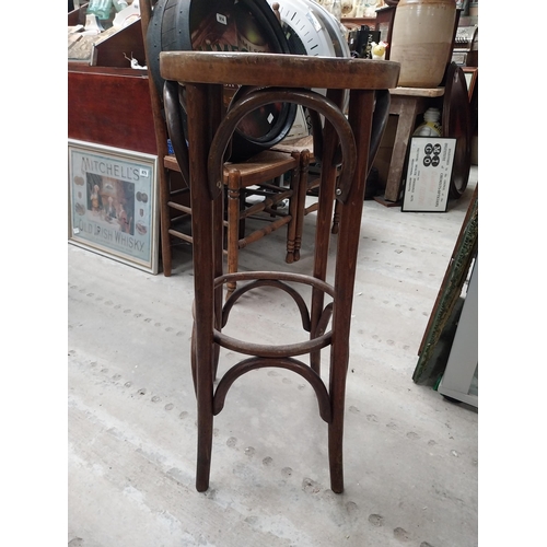 507 - Two bentwood bar stools. {80 cm H x 37 cm Dia.}.