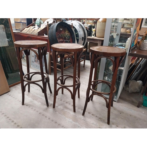 508 - Three bentwood bar stools. {80 cm H x 37 cm Dia.}.