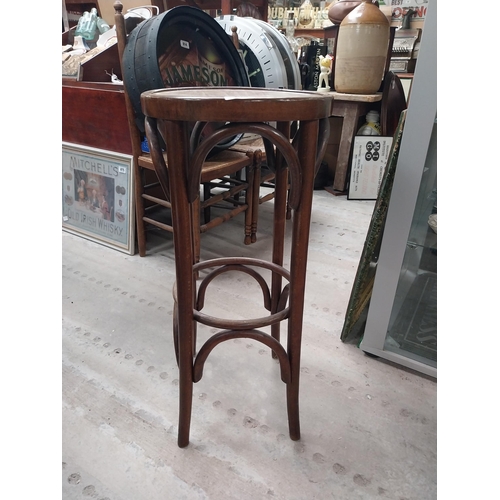 508 - Three bentwood bar stools. {80 cm H x 37 cm Dia.}.