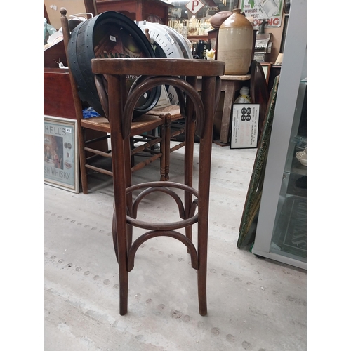 508 - Three bentwood bar stools. {80 cm H x 37 cm Dia.}.