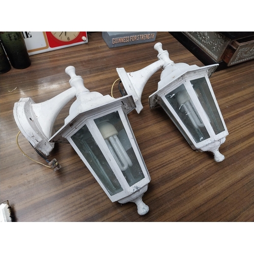 512 - Pair of metal and glass wall lanterns. {33 cm H x 21 cm W x 20 cm D}.