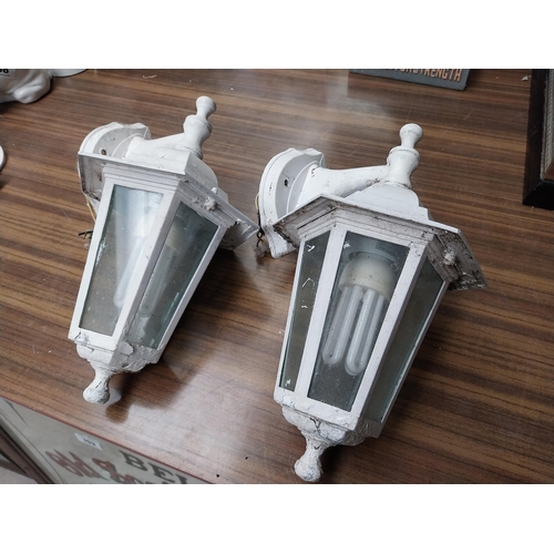 512 - Pair of metal and glass wall lanterns. {33 cm H x 21 cm W x 20 cm D}.