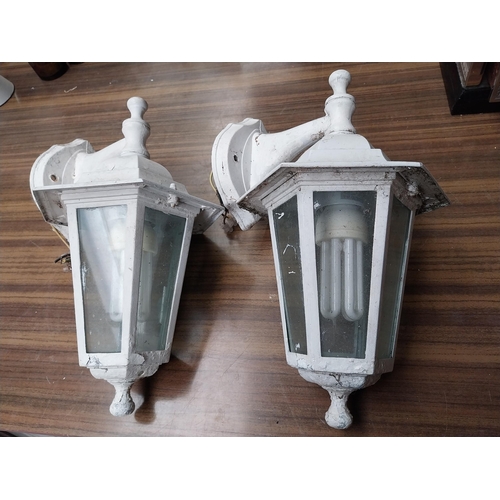 512 - Pair of metal and glass wall lanterns. {33 cm H x 21 cm W x 20 cm D}.