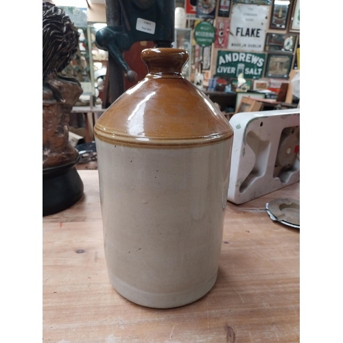 520 - Robinson and Riddley Wellingborough stoneware flagon {34 cm H x 15 cm Dia.} and SRD stoneware flagon... 