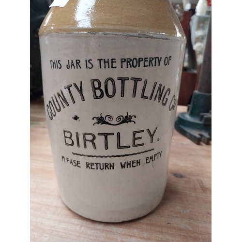 521 - County Bottling Company Birtley {21 cm H x 13 cm Dia.} and another stoneware flagon {31 cm H x 18 cm... 