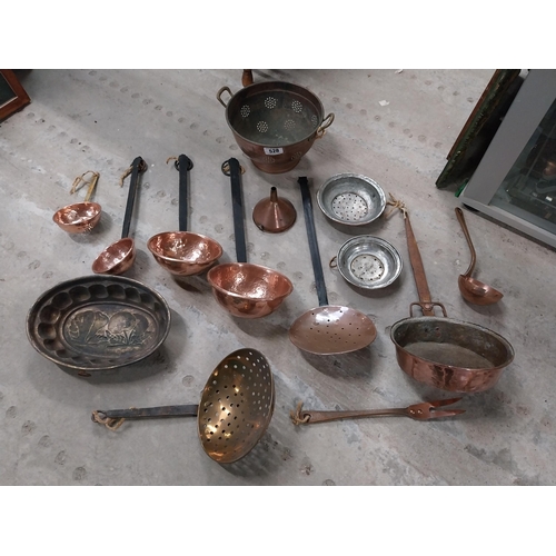 528 - Collection of 19th C. copperware including colanders and jelly moulds.