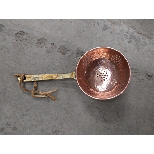 528 - Collection of 19th C. copperware including colanders and jelly moulds.