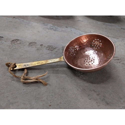 528 - Collection of 19th C. copperware including colanders and jelly moulds.