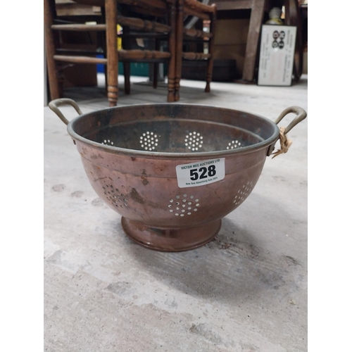 528 - Collection of 19th C. copperware including colanders and jelly moulds.