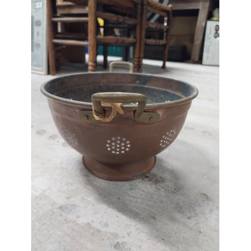 528 - Collection of 19th C. copperware including colanders and jelly moulds.