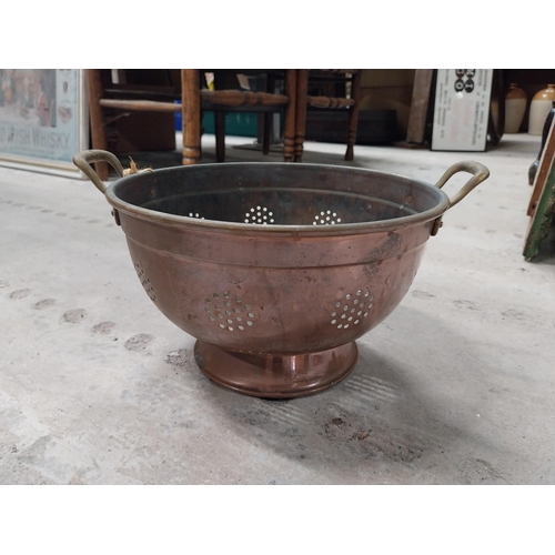 528 - Collection of 19th C. copperware including colanders and jelly moulds.