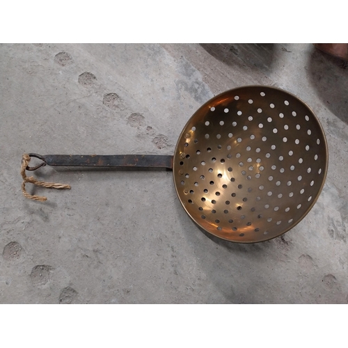 528 - Collection of 19th C. copperware including colanders and jelly moulds.