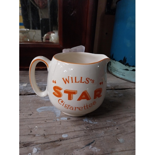 53 - Wills's Star ceramic water jug. {11 cm H x 14 cm W x 10 cm D}