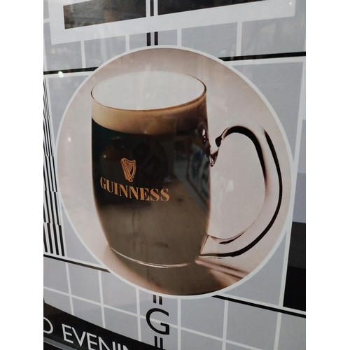 537 - Guinness A Good Evenings Entertainment framed advertising print. {33 cm H x 64 cm W}.