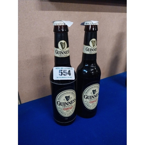 554 - Two bottles of Guinness.