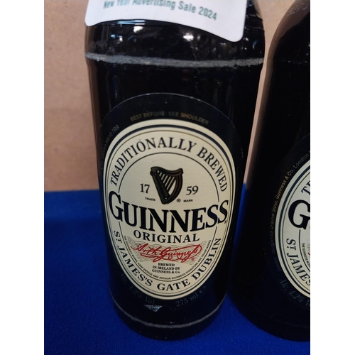 554 - Two bottles of Guinness.