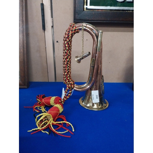 556 - Copper and Brass Army bugle. {25 cm L}.