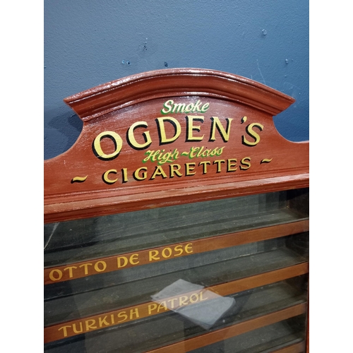 579 - Ogden's cigarettes dispensing advertising cabinet with seven pull out brand name drawers {H 77cm x W... 