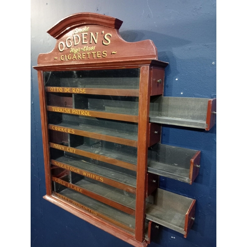 579 - Ogden's cigarettes dispensing advertising cabinet with seven pull out brand name drawers {H 77cm x W... 