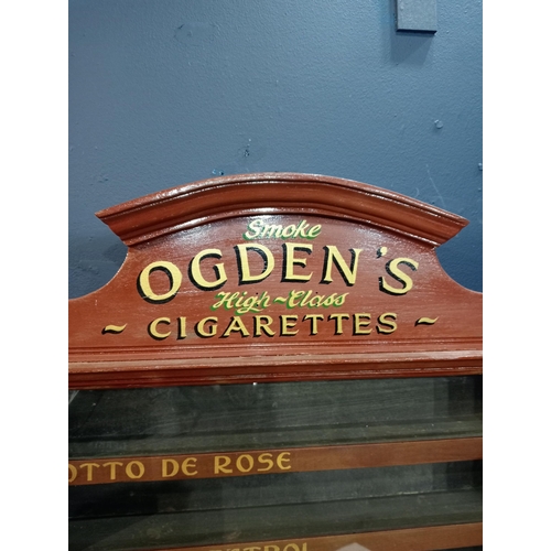 579 - Ogden's cigarettes dispensing advertising cabinet with seven pull out brand name drawers {H 77cm x W... 