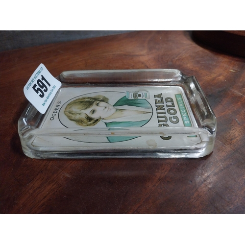 591 - Ogden's Guinea Gold glass ashtray. {15 cm H x 9 cm W}.