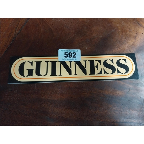 592 - Guinness Perspex stick on shelf sign. {6 cm H x 26 cm W}.