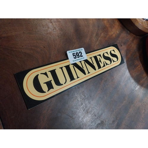 592 - Guinness Perspex stick on shelf sign. {6 cm H x 26 cm W}.