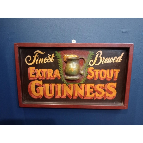 597A - Finest brewed extra stout Guinness wooden advertising board {H 31cm x W 53cm x D 4cm}.