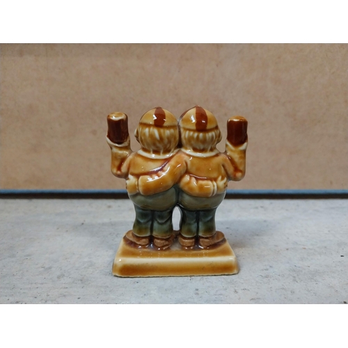 605 - Four miniature ceramic Guinness advertising figures. {9 cm H} approx.