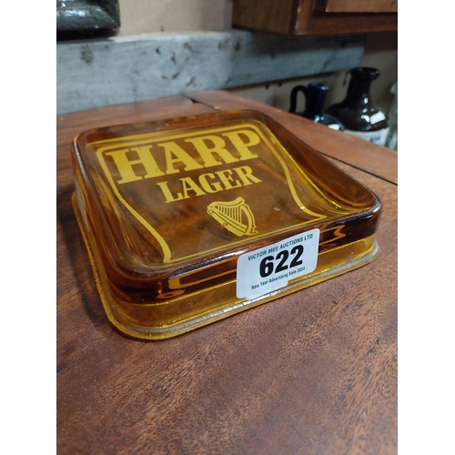 622 - Harp Lager amber glass advertising ashtray. {4 cm H x 15 cm W x 15 cm D}.