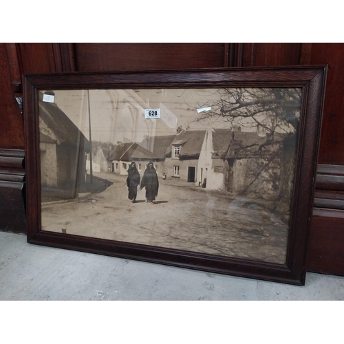 628 - Framed black and white print of rural Irish village. {55 cm H x 85 cm W}.