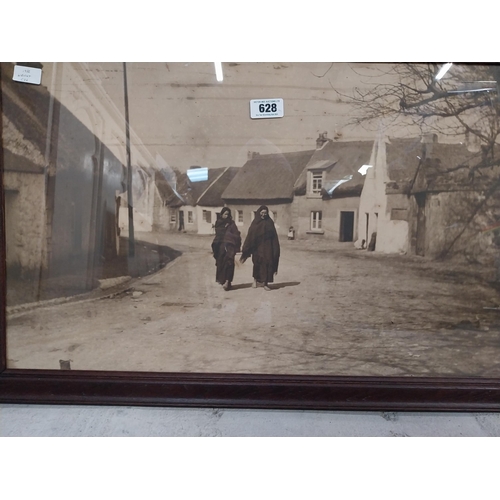 628 - Framed black and white print of rural Irish village. {55 cm H x 85 cm W}.