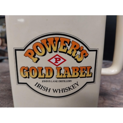 635 - Powers Gold Label Irish Whiskey Wade ceramic advertising jug. {16 cm H x 16 cm W x 9 cm D}.