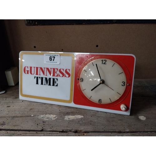 67 - Guinness Time Perspex advertising clock. {14 cm H x 38 cm W}.