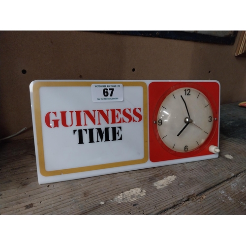 67 - Guinness Time Perspex advertising clock. {14 cm H x 38 cm W}.