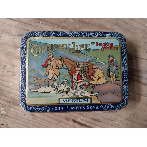 68 - Two advertising tobacco tins - Country Life and Clipper. {3 cm H x 11 cm W x 8 cm D} approx.