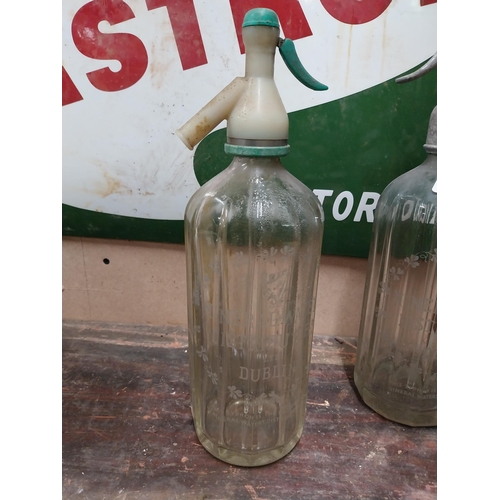 7 - Two soda siphons - Mineral Waters Distillers Dublin. {32 cm H x 9 cm Dia.}.