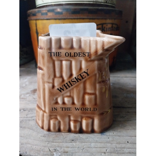 73 - Old Bushmills Whiskey ceramic advertising water jug Arklow pottery. {12 cm H x 16 cm W x 13 cm D}.