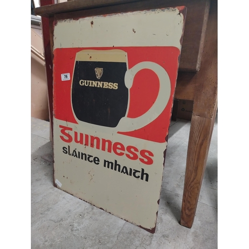 79 - Guinness tinplate bilingual advertising sign. {70 cm H x 50 cm W}.