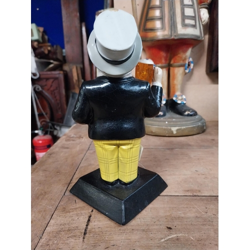 91 - William Younger Ruberoid advertising figure. {22 cm H x 12 cm W x 10 cm D}.