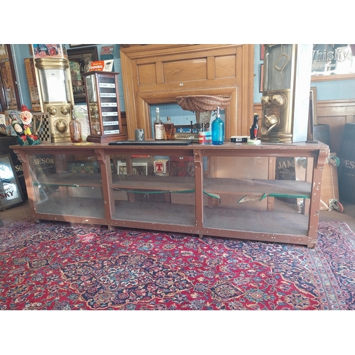 150A - Early 20th C. painted pine shop counter with glass panels {85 cm H x 275 cm W x 62 cm D}.