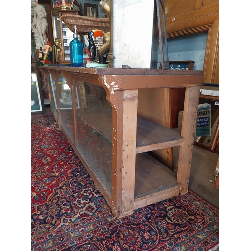 150A - Early 20th C. painted pine shop counter with glass panels {85 cm H x 275 cm W x 62 cm D}.