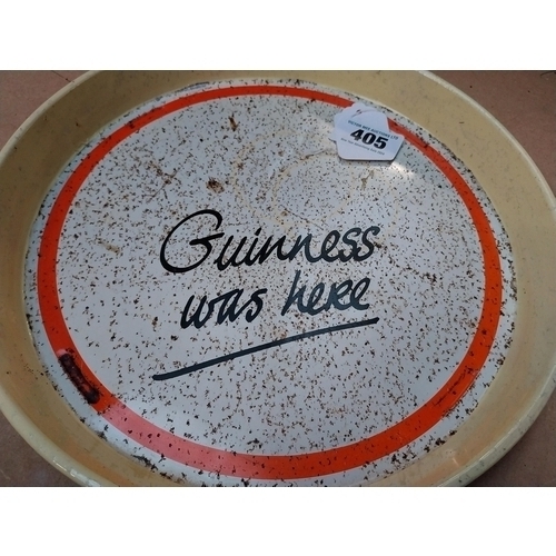 405 - Two Guinness tinplate advertising trays. {30 cm Dia.}.