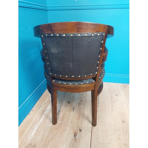 118 - Mahogany and leather office chair with brass studs {86 cm H x 60 cm W x 54 cm D}.