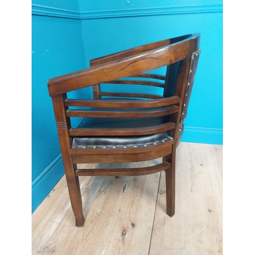 118 - Mahogany and leather office chair with brass studs {86 cm H x 60 cm W x 54 cm D}.