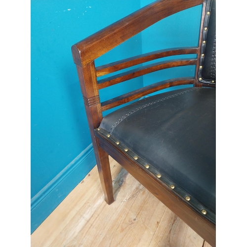 118 - Mahogany and leather office chair with brass studs {86 cm H x 60 cm W x 54 cm D}.