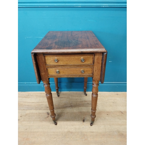 128 - 19th C. mahogany drop leaf lamp table with two drawers in the frieze raised on turned legs and brass... 