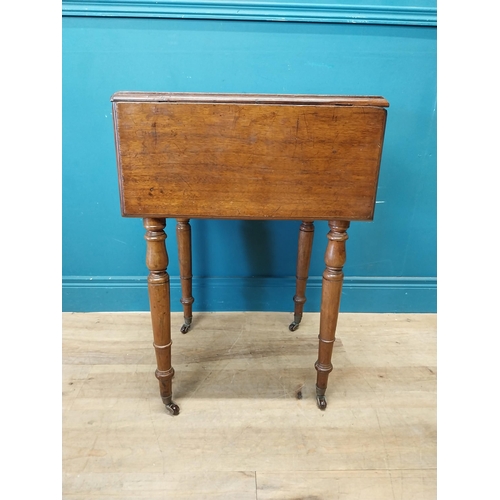 128 - 19th C. mahogany drop leaf lamp table with two drawers in the frieze raised on turned legs and brass... 